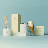 A colourful display of products featuring ice cream cones, scented candles, fragrant diffusers and decorative packaging box.